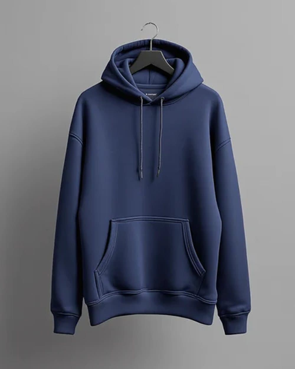 Premium navy hoodie on a soft studio background